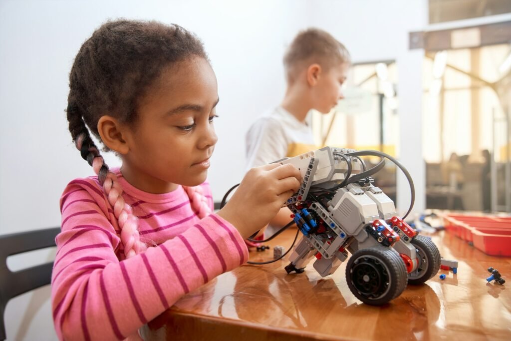 African girl creating robot