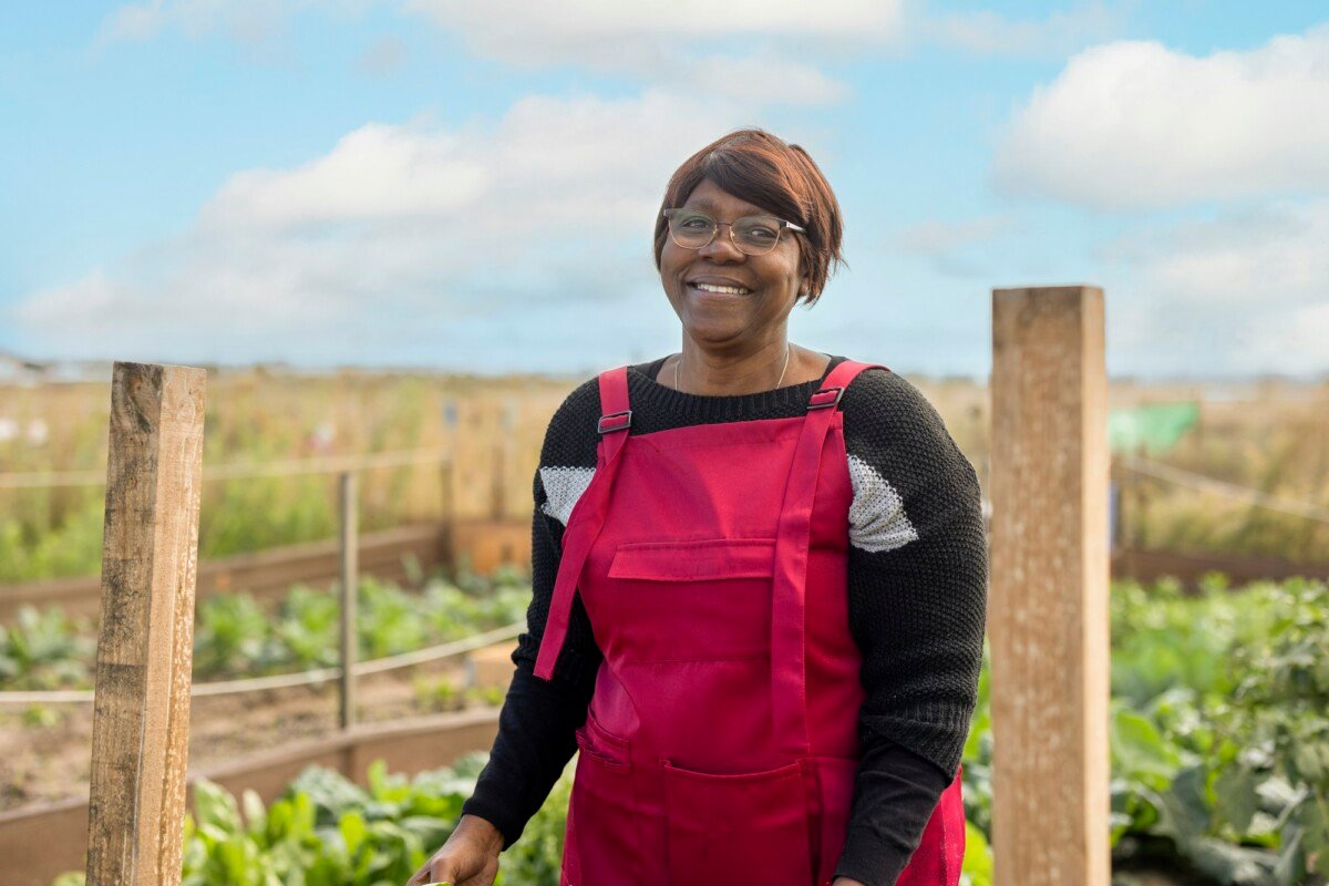 african senior woman farmer in the field