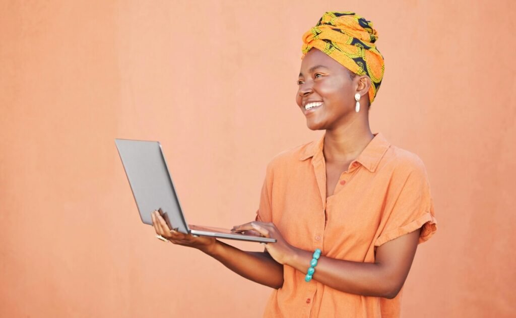 Wall, laptop or happy black woman thinking of research about creative small business ideas in Kenya